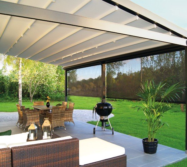 Outdoor Living Area on the Backyard with furniture and barbecue